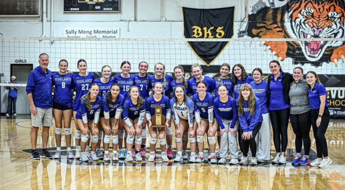 Highlands High School High School varsity volleyball team celebrates their district championship award.